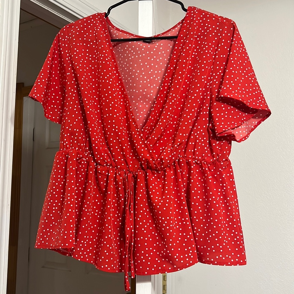 Cute red blouse.